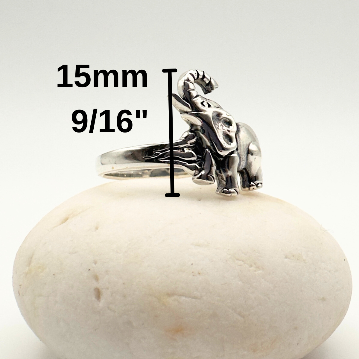 Silver ring with measurement details on a white stone