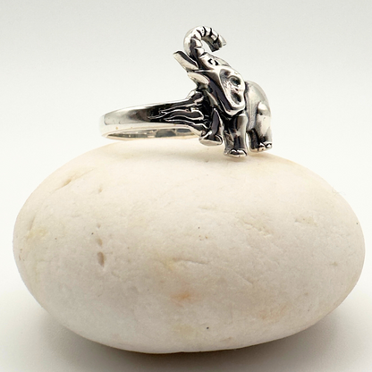 Silver ring with a detailed design on a white stone