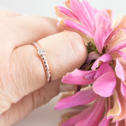 Textured Band with Small Zircon Accent in Rose Gold Plated Sterling Silver