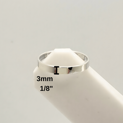 Silver ring with measurement details on a white background